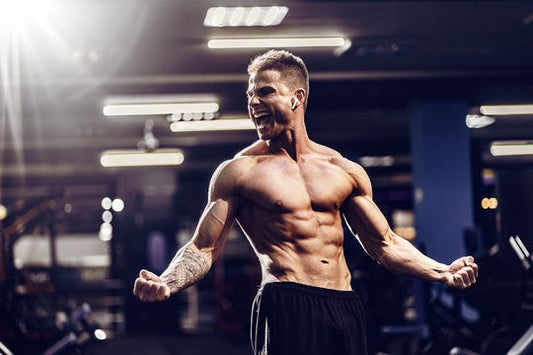 A lean, muscular body builder flexing his muscles.